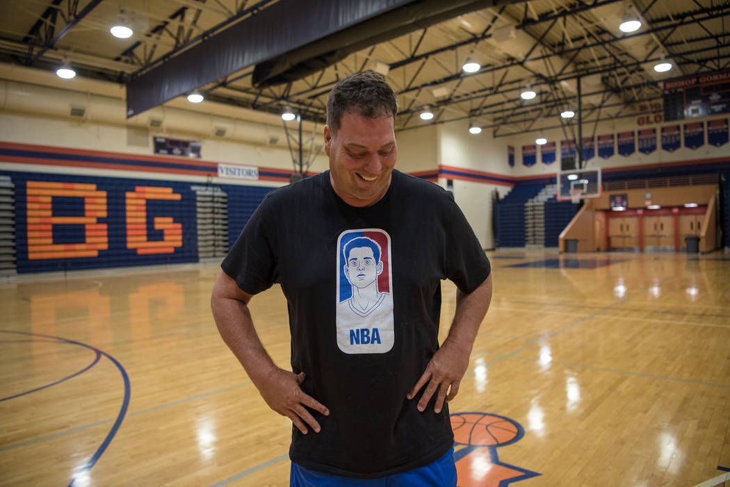 Andy Mitchell, a family friend of Zach Collins, poses for a portrait with his commemorative ...