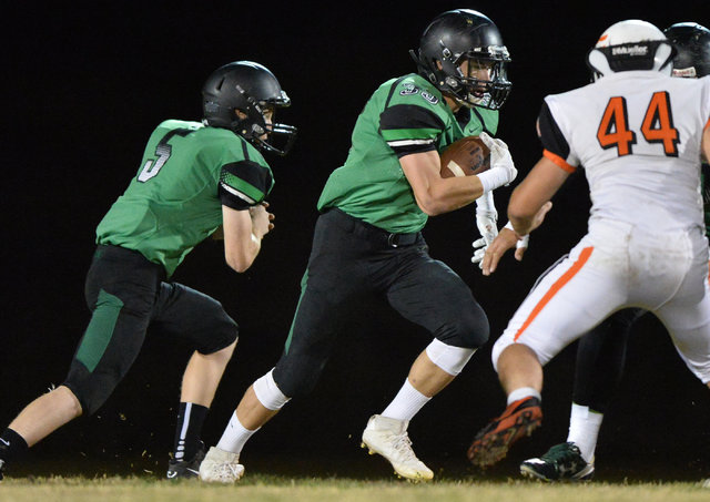 Virgin Valley running back Maurice Jayden Perkins (33) runs the ball during the Virgin Valle ...