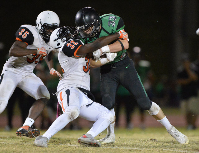 Virgin Valley running back Maurice Jayden Perkins (33) hits a defender during the Virgin Val ...