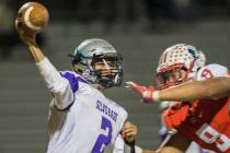 Silverado’s Christian Baltodano (2) just gets a pass away as he’s hit by Liberty ...