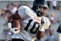 Las Vegas High’s Elijah Hicks runs with the ball during a scrimmage against Green Vall ...