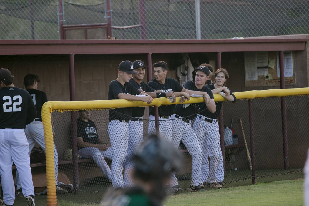 Faith Lutheran Crusaders in the dugout during a game at Faith Lutheran High School on Thursd ...