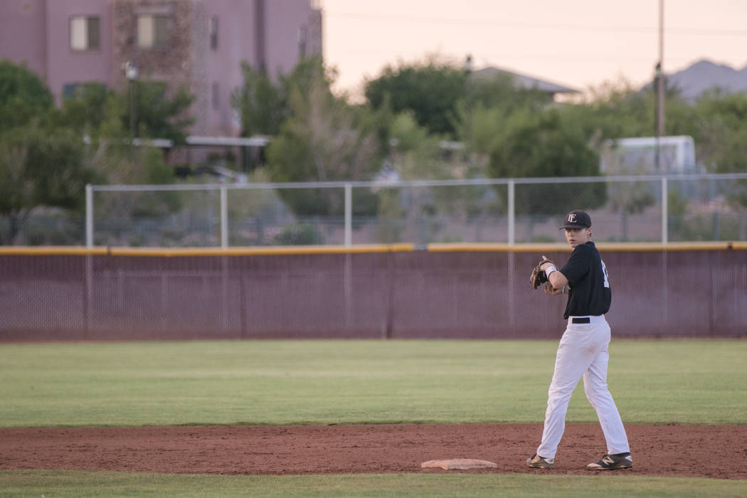 Faith Lutheran Crusader Paulshawn Pasqualotto tossing the ball to the pitcher at shortstop d ...
