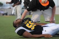 An athletic trainer tends to injured lineman K Rell Craft during Clark’s 39-0 win ...