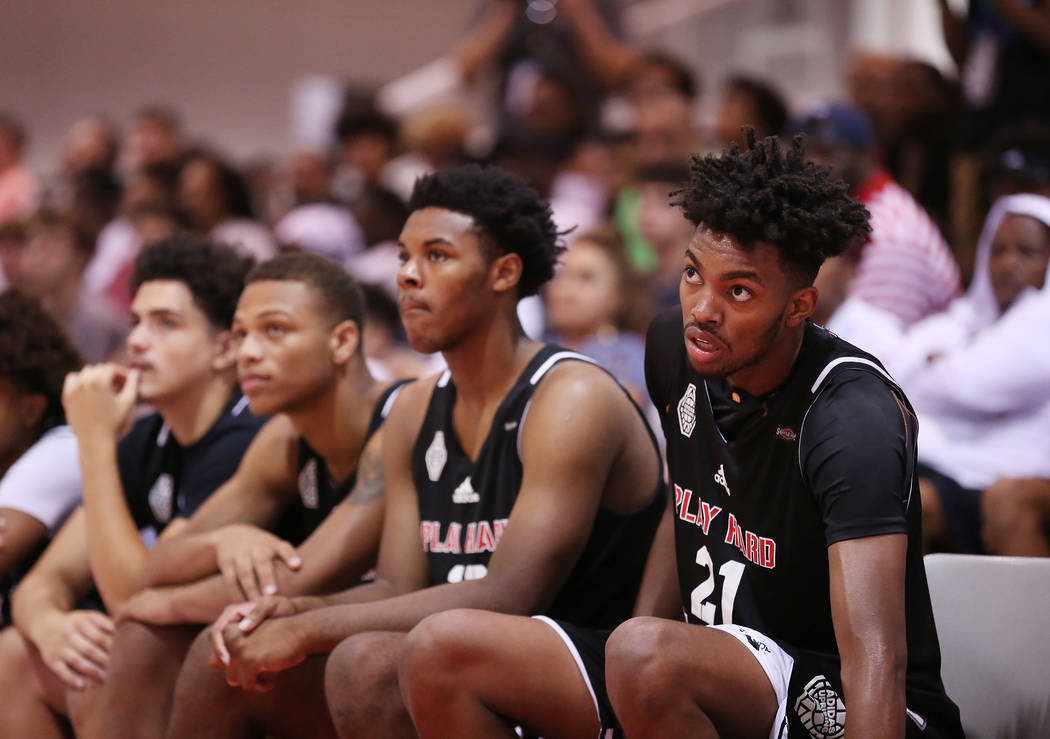 Play Hard Play Smart player Jordan Brown, right, sits on the bench during an Adidas Summer C ...