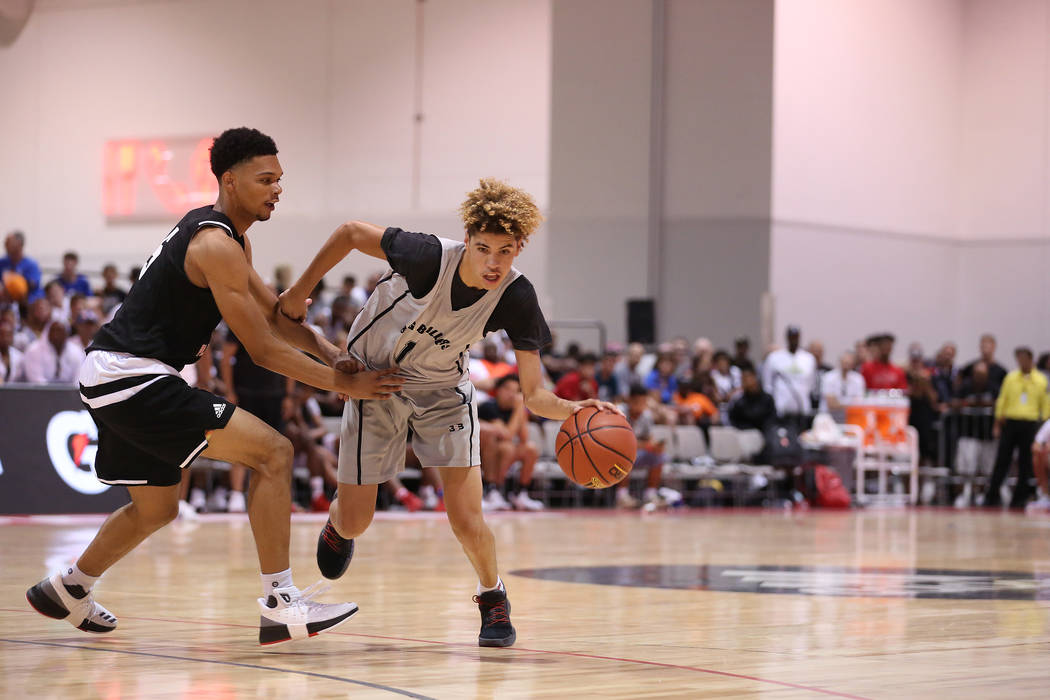Big Baller Brand player LaMelo Ball tries to drive past a Play Hard Play Smart player during ...