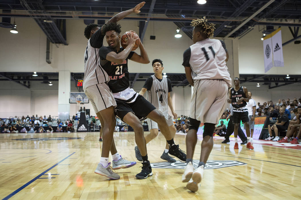 Play Hard Play Smart player Jordan Brown brings the ball to the basket during an Adidas Summ ...