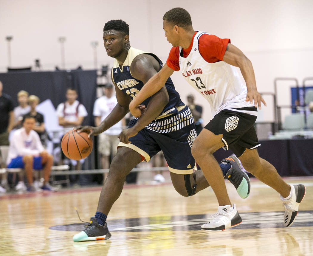 SC Supreme forward Zion Williamson (12) drives the ball by Play Hard Play Smart’s Chri ...