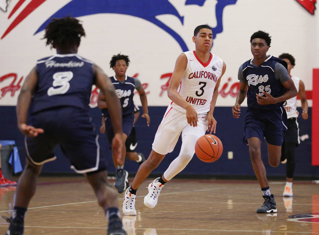 Liberty sophomore and California United player Julian Strawther (3) brings the ball up the c ...