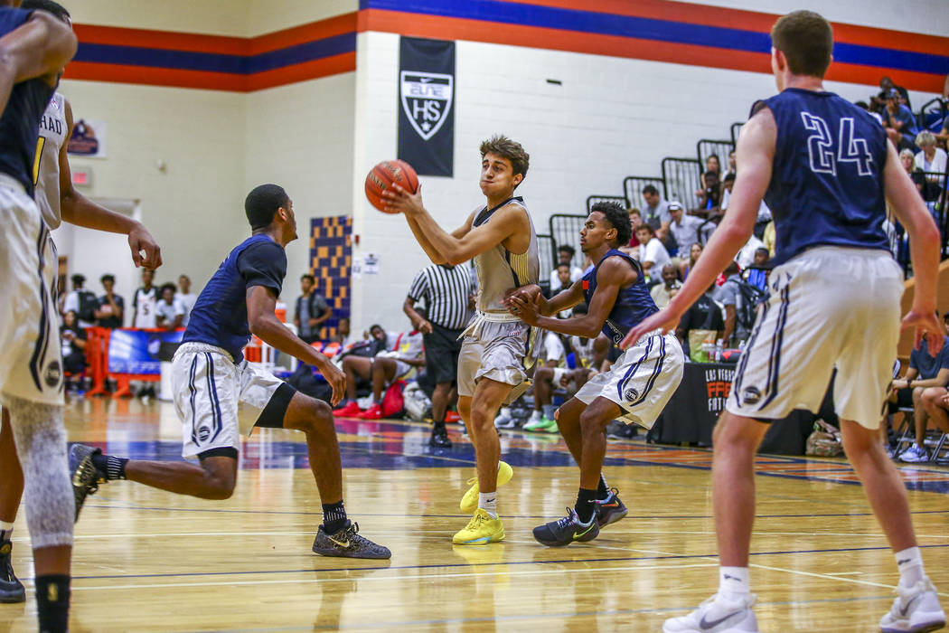 Team Thad’s Roman Ruio, center, looks to pass while warding off New York defenders dur ...