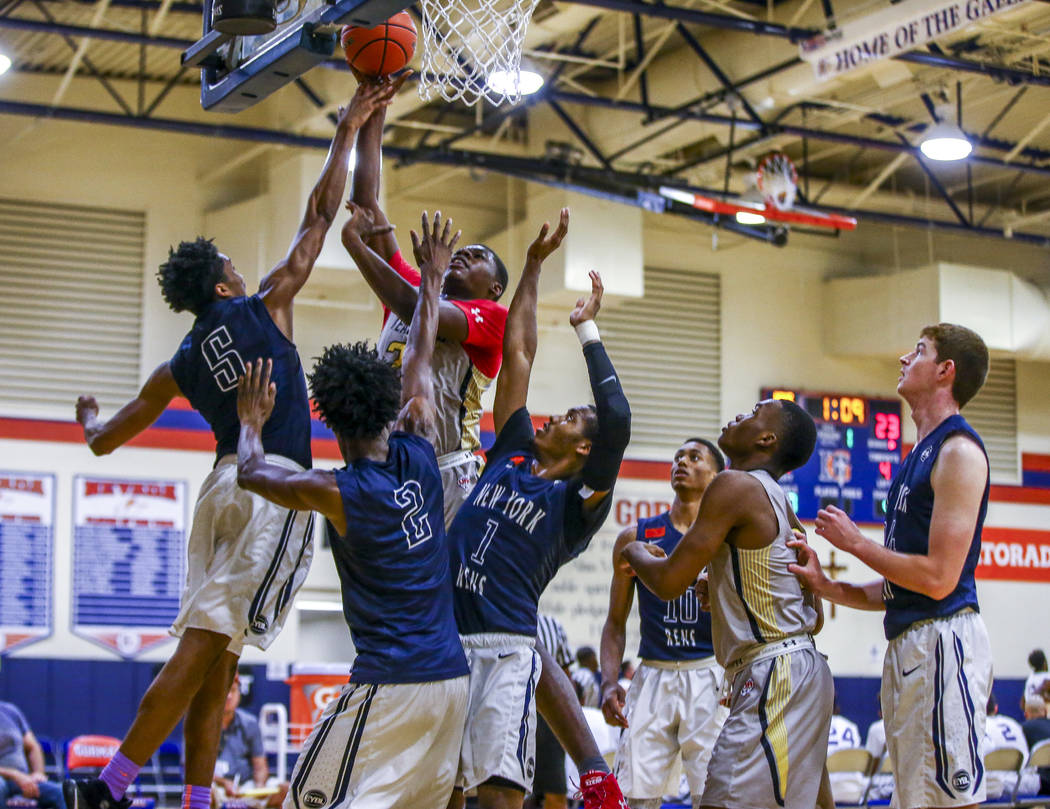 Team Thad’s Javian Fleming goes up for a shot against a myriad of New York defenders d ...