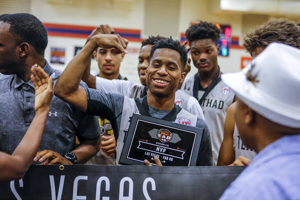 Team Thad’s Tyler Harris, center, celebrates after being crowned MVP during the Las Ve ...