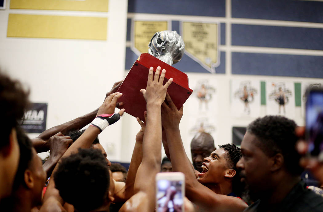 California Supreme Elite players hold their Platinum Elite Championship game trophy after wi ...