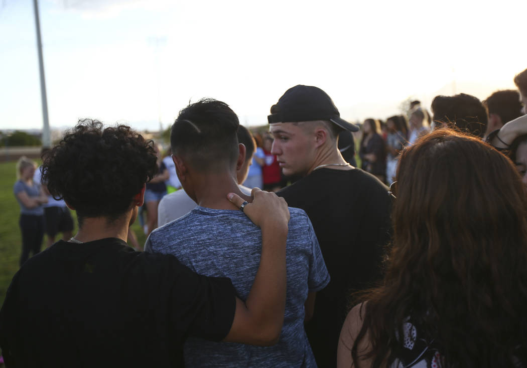 People gather during a vigil for Haylei Hughes, a former Cimarron-Memorial student-athlete, ...