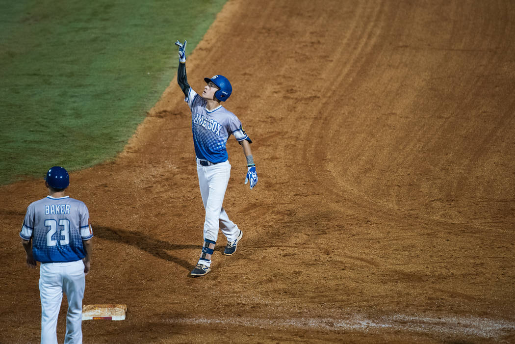 John Howard Bobo of Henderson, Nev., Post 40 celebrates a base hit against Shrewsbury, Mass. ...