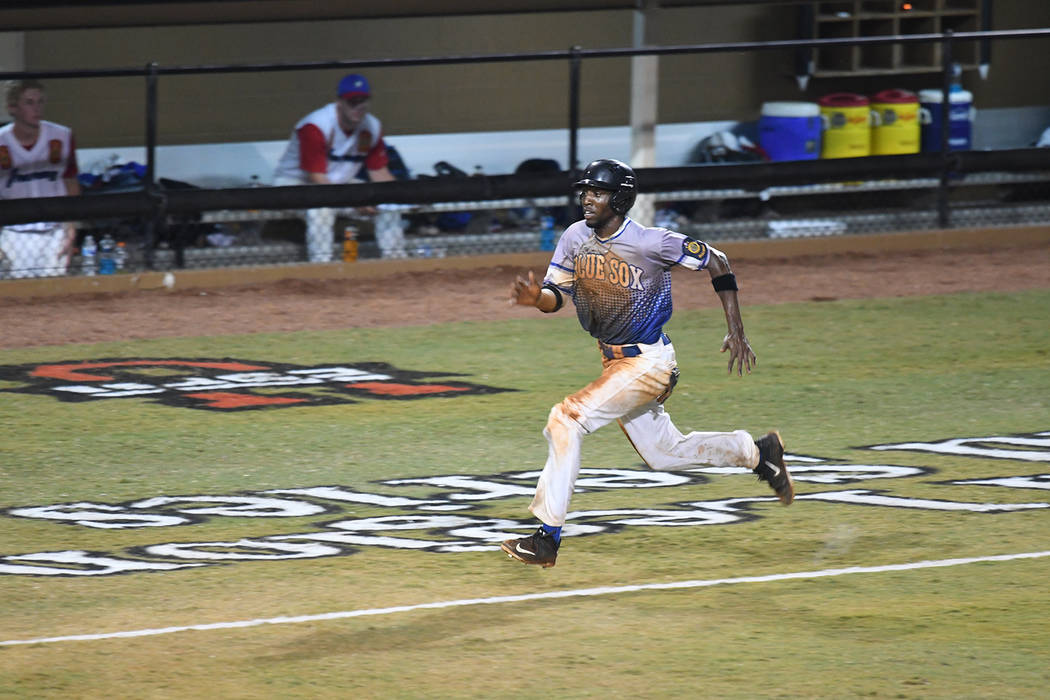 J.J. Smith of Henderson, Nev., Post 40 runs home to score the go-ahead run against Omaha, Ne ...
