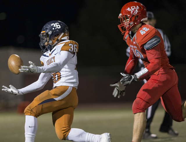 Legacy’s Amorey Foster (36) attempts to pull in a pass with Arbor View’s Andrew ...