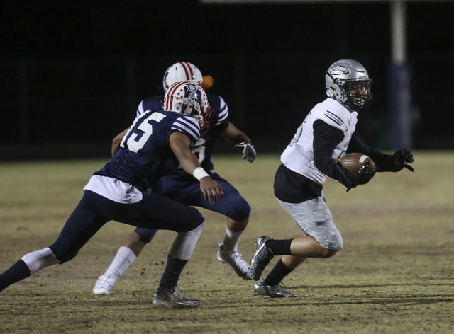 Green Valley wide receiver Christian Mayberry (25) runs the ball past Liberty defense during ...