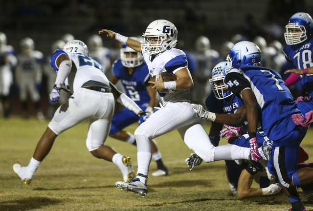 Green Valley’s Braxton Harms (32) runs the ball against Basic during a football game a ...