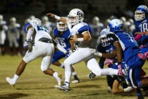 Green Valley’s Braxton Harms (32) runs the ball against Basic during a football game a ...