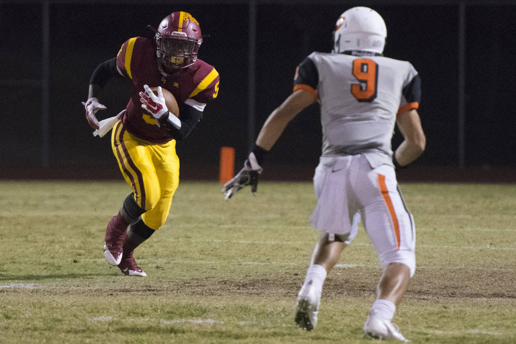 Del Sol’s Taariq Flowers (5) runs with the ball against Chaparral’s Devin Gaddy ...