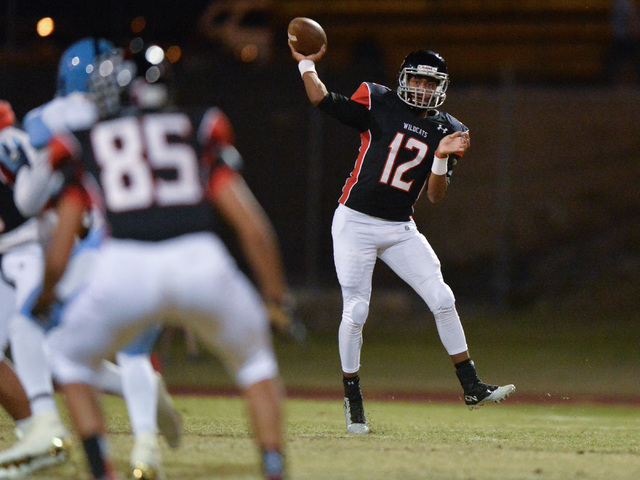 Las Vegas quarterback Zach Matlock (12) throws a pass during the Las Vegas High School Canyo ...