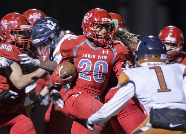 Arbor View’s Jaquari Hannie (20) sprints past Legacy’s Jamaal Britt (1) during t ...