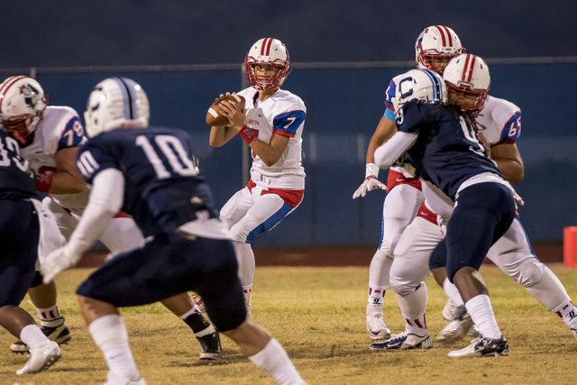 Liberty Patriots quarterback Kenyon Oblad (7) drops back to throw against the Centennial Bul ...