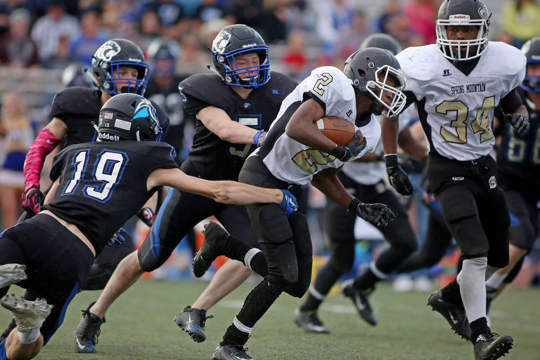 Spring Mountain’s LaShawn Young (2), runs with the ball during the class 1A state foot ...