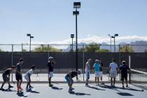 Meadows School tennis players warm upʤuring practice at the Meadows School on Thursday ...