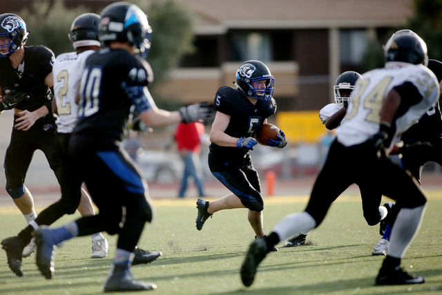 Pahranagat Valley’s David Ingram (5), runs with the ball during the class 1A state foo ...