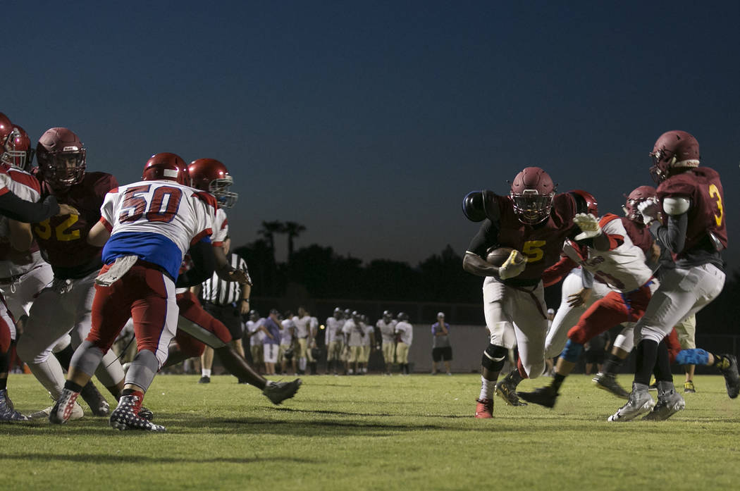 Del Sol senior Taariq Flowers runs to the end zone with the ball during a three-team scrimma ...