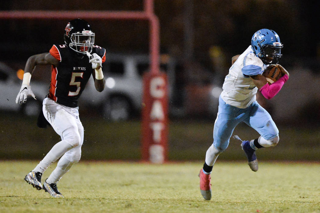 Canyon Springs running back Jayvion Pugh (22) runs the football during the Las Vegas High Sc ...