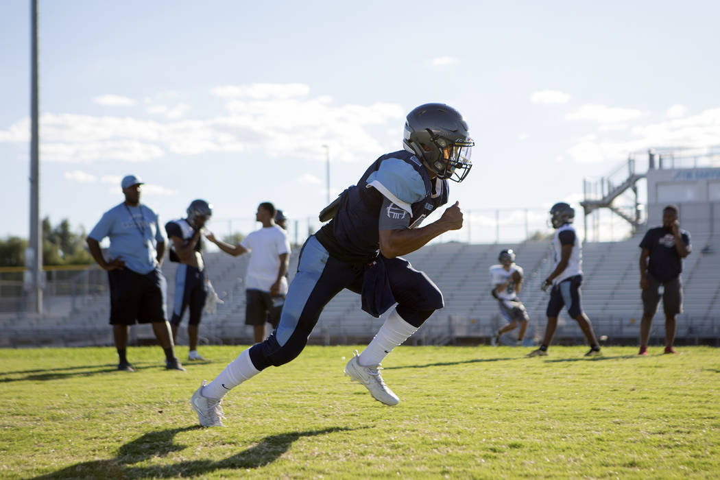 Canyon Springs football player Diamante Burton runs drills during practice at Canyon Springs ...