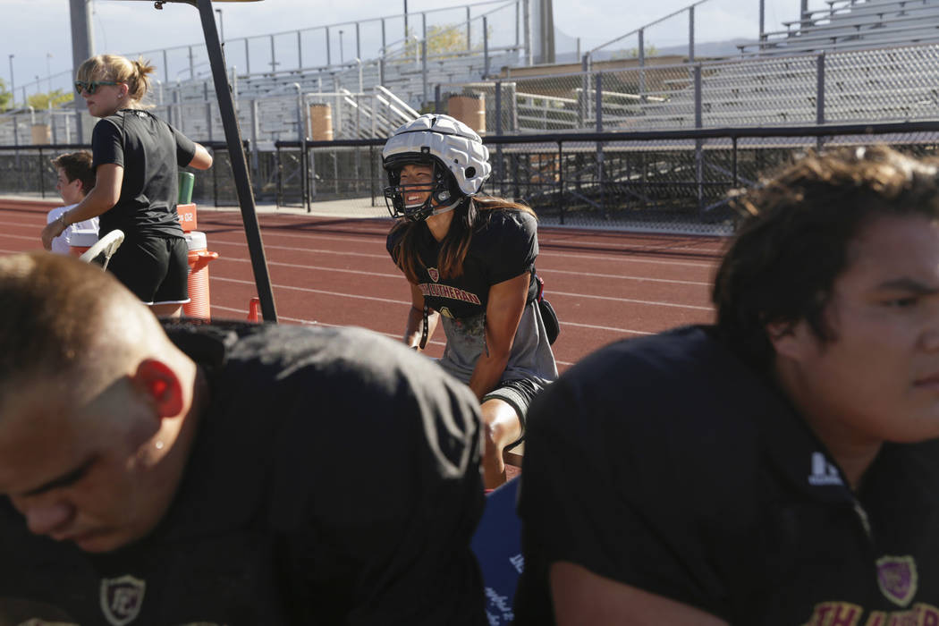Faith Lutheran defensive back Josh Hong (1) takes a break during practice at Faith Lutheran ...