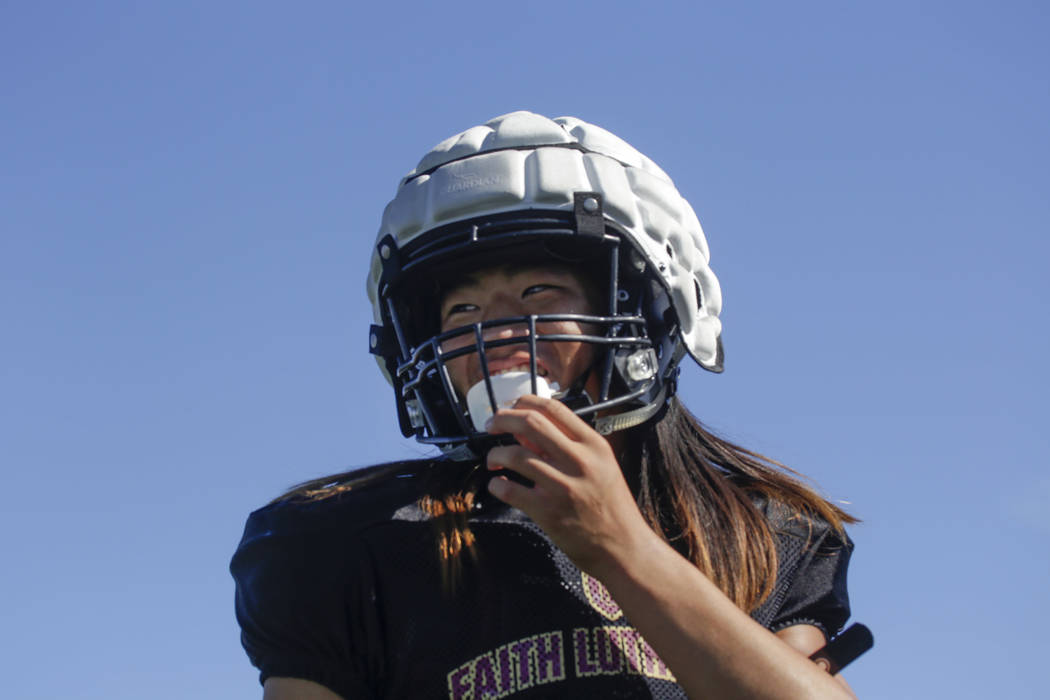 Faith Lutheran defensive back Josh Hong (1) takes a break during practice at Faith Lutheran ...