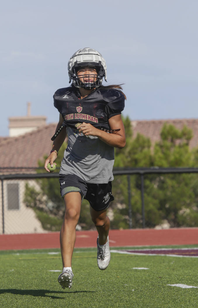 Faith Lutheran defensive back Josh Hong (1) runs a drill during practice at Faith Lutheran H ...