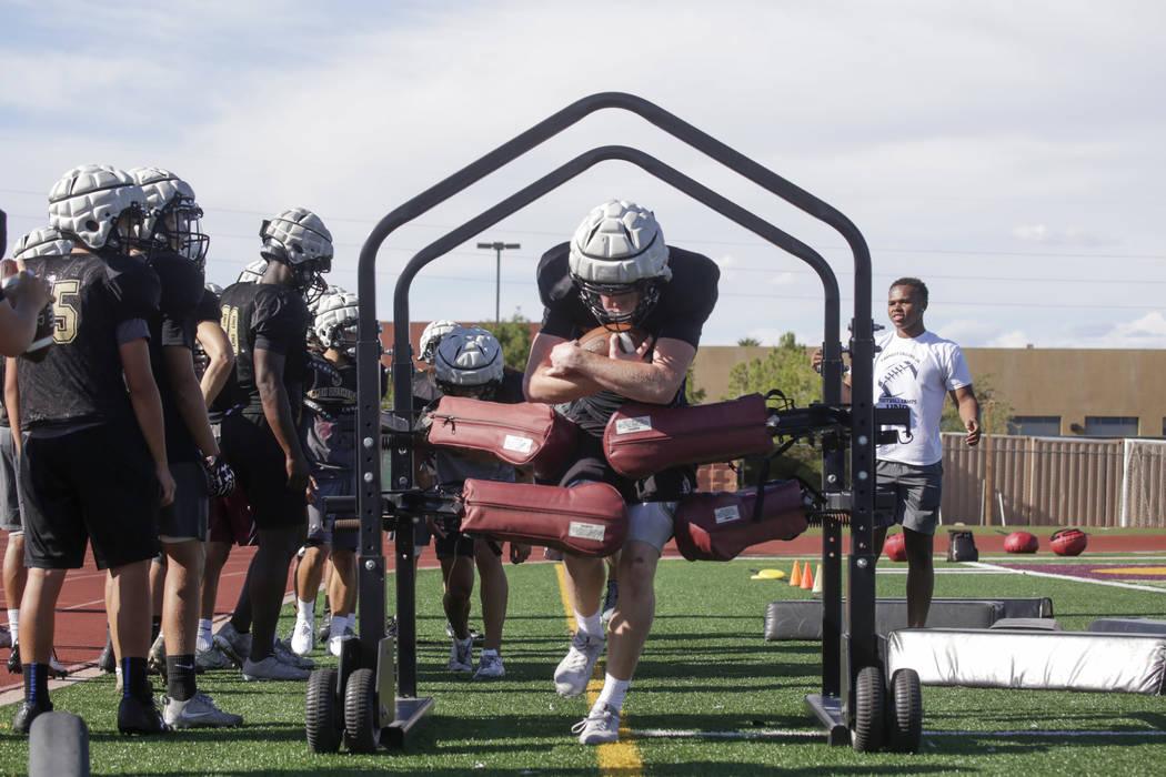 Faith Lutheran wide receiver Elija Kothe (8) runs a drill during practice at Faith Lutheran ...