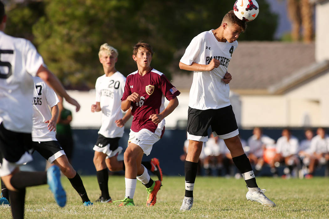 Palo Verde player Ryan Nogues heads the ball during the a against Faith Lutheran at Green Va ...