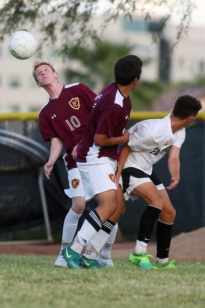 Faith Lutheran player Zac Abdo heads the ball during a game against Palo Verde at Green Vall ...
