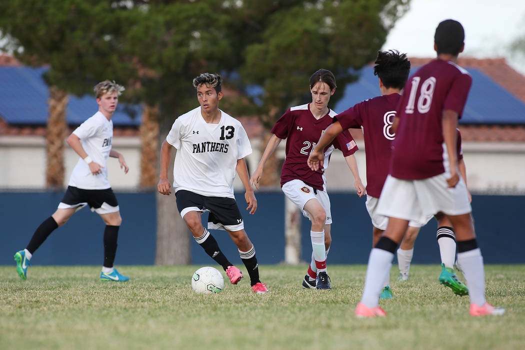 Palo Verde player Zechariah Ruffer dribbles the ball during a game against Faith Lutheran at ...