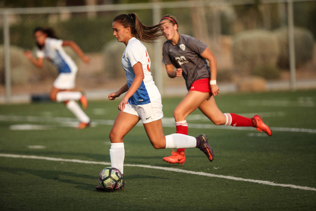 Bishop Gorman’s Alexa Fehlman, 32, dribbles the ball during a game against Arbor View ...
