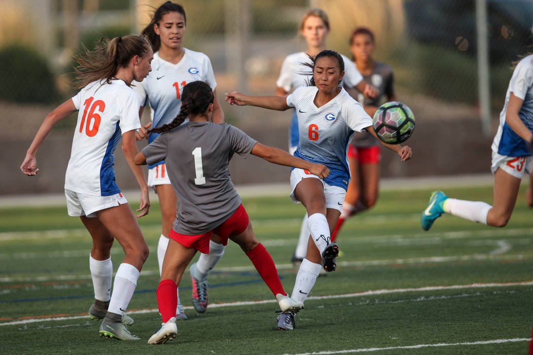 Bishop Gorman’s Caitlyn Rueca, 6, lobs the ball during a game against Arbor View High ...