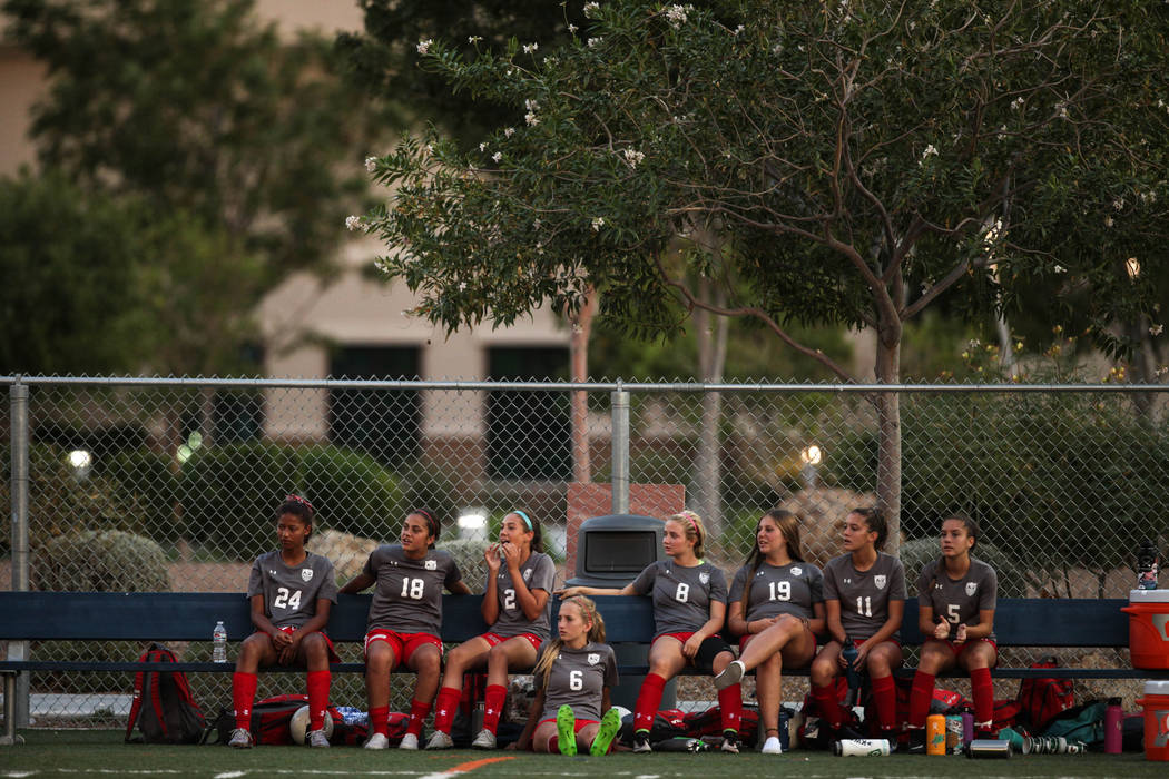 Players from Arbor View sit on a bench during a game against Bishop Gorman at Bishop Gorman ...