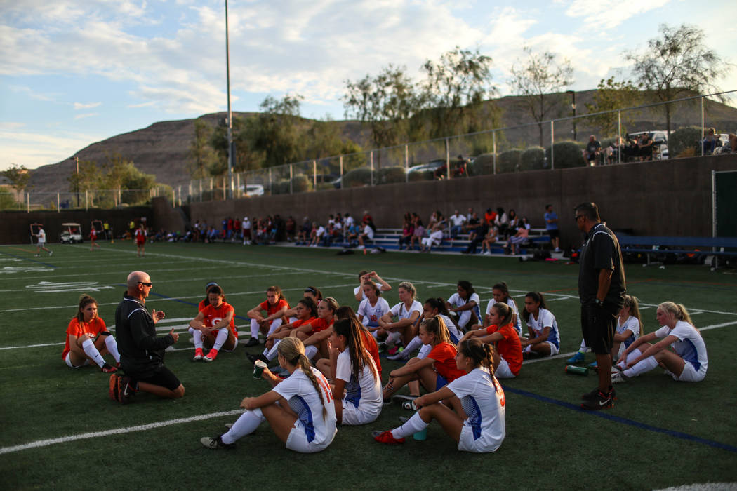 Bishop Gorman head coach Doug Borgel speaks to players during half-time against Arbor View a ...