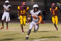 Chaparral’s Tyray Collins (19) runs with the ball during a football game at Del Sol in ...