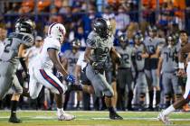 Bishop Gorman’s Brevin Jordan (9) carries the ball after a catch against DeMatha Catho ...