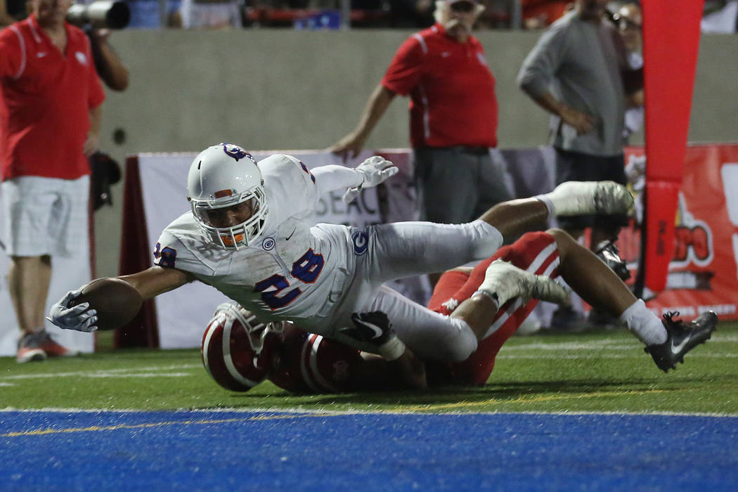 Bishop Gorman player Amod Cianelli (28) makes a touchdown during their game against Mater De ...