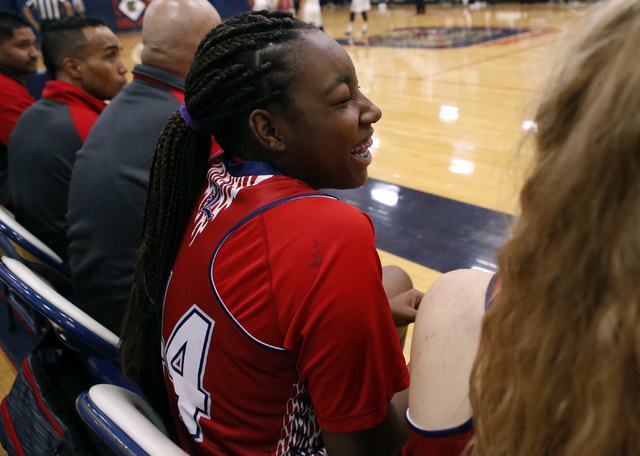 Liberty junior Dre’una Edwards (#44) laughs with a teammate during a basketball game o ...