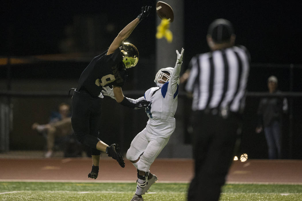 Faith Lutheran’s Keagan Touchstone (9) leaps for the ball against Green Valley’s ...